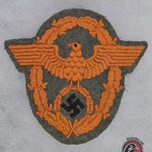 #1702 - German WWII Gendarmerie Sleeve Eagle – Orange Embroidery on Field-Grey Wool